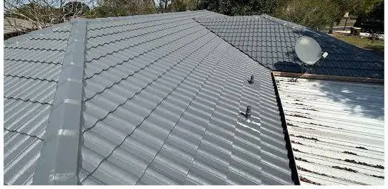 The same roof after restoration, resprayed in charcoal